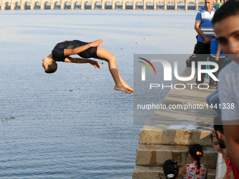 People Swim In The River Nile During The Eid al-Adha Festival  In Egypt
