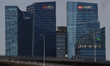 (L-R) The DBS Bank Ltd. , HSBC Holdings Plc, and the Standard Chartered Plc logos are disp...