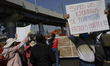 A group of people demonstrate at ground zero where on the night of 3 May 2021, 27 people d...