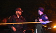 Newark police officers at the crime scene investigating the deadly shooting which killed o...