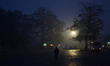 An indian passenger walks at District bus station to catch his bus ,during a cold and rain...