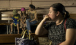 People take cover inside a school basement as a  shelter during an air raid alert in Kyiv,...