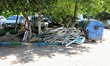 ODESA, UKRAINE - JUNE 10, 2023 - Smashed window frames are piled by garbage containers aft...