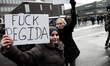 Asylum activists joins the protest with signs. Clashes between anti-islamist protesters an...