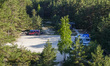 Campervans and campers parked on the forest parking place  are seen on the Cape Kolka,  La...