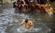 Nepalese Hindu devotees take holy baths in the holy Hanumante river during the fourth day...