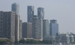 Haze from wildfire smoke shrouds buildings along the Toronto city skyline seen from Lake O...