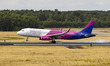 Wizz Air Airbus A320 aircraft as seen flying, landing and taxing at Eindhoven Airport EIN...