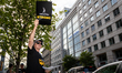 Rick Kain of the Mid-Atlantic chapter of SAG-AFTRA,  actors, and other union members picke...