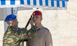 Heatwave in Greece. A soldier as seen wipe off the sweat from the face and cool off with w...