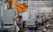 An employee works on a hydrogen fuel cell production line in Zhangjiakou, Hebei province,...