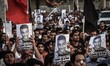 protesters raising martyr Sadiq Sabt picture during the funeral -thousands attended to the...
