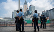Police officers standing guard outside the legislative council complex on October 25, 2023...