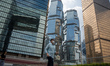 A man walks pass office buildings on October 25, 2023 in Hong Kong, China. John Lee today...