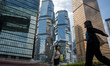 People walks pass office buildings on October 25, 2023 in Hong Kong, China. John Lee today...