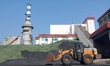 YANTAI, CHINA - OCTOBER 25, 2023 - A excavator transports coal for heating at a heat compa...