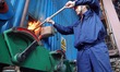 YANTAI, CHINA - OCTOBER 25, 2023 - A worker puts a torch into a heating boiler at a heat c...