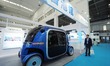 BEIJING, CHINA - OCTOBER 25, 2023 - Visitors visit a self-driving minibus at the booth of...