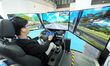 BEIJING, CHINA - OCTOBER 25, 2023 - Visitors experience a car driving simulation system at...