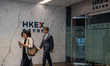 People leaving the Hong Kong Stock Exchange on October 25, 2023 in Hong Kong, China. John...