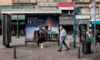 A woman seen sitted on a bus station in the center of Athens, Greece on October 25, 2023. 
