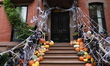 Halloween decorations and pumpkins cover the stairs of a Greenwich Village townhouse in Ne...