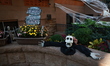 Spider webs and festive pumpkins cover the exterior of a townhouse in the Carnegie Hill to...