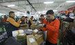 CHENZHOU, CHINA - NOVEMBER 10, 2023 -  Workers sort express parcels at the mail processing...