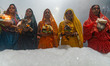 Hindu devotees stand on the banks of river Yamuna amidst the Industrial toxic foam during...