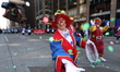 A member of the Circus Clowns is hitting the photographer with confetti during the 97th Ma...