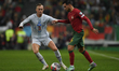 Gudmundur Thorarinsson and Ricardo Horta are in action during the Group J - UEFA EURO 2024...