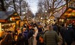 People are walking near a Christmas fair in the Karl Johans Gate area near downtown Oslo,...