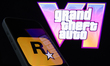GTA VI logo from the trailer displayed on a laptop screen and Rockstar Games logo displaye...