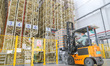 Goods are moving automatically on a tall shelf in an automated warehouse of a food company...