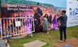 People are taking pictures in front of an art installation at the 29th Kolkata Internation...