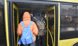 Passengers are getting on a bus that is operating between the closed metro stations of the...