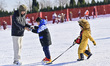 A child is experiencing skiing with his family at the Tuoshan Ski Resort in Qingzhou City,...