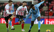 Haji Wright of Coventry City is breaking away from Dan Neil of Sunderland during the Sky B...