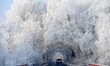 People are admiring the rime scenery on a street following a snowfall in Shenyang, Liaonin...