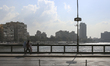 People are walking on the Qasr Al Nile Bridge during a sunny day in Cairo, Egypt, on Decem...