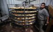 Palestinians are baking bread in Deir al Balah, central Gaza Strip, on January 30, 2024, a...