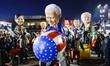 A float featuring a satirical representation of Joe Biden is on display at the first maske...