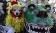 A dog is disguised as a Chinese dragon next to the representation of Quetzalcoatl, or the...