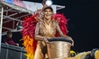 Aline de Oliveira is participating in the parade of the samba schools in Sao Paulo, which...