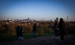 People are taking pictures of the London skyline from the top of Primrose Hill on January...