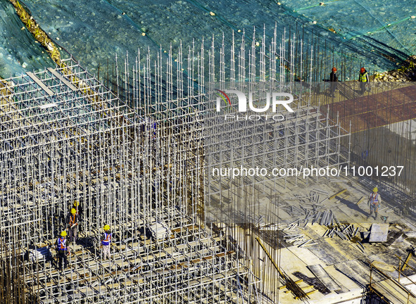 Workers are reinforcing the Yundong Gate at the construction site for the Subei Irrigation Canal in Huai'an, China, on February 16, 2024.  by Costfoto/NurPhoto