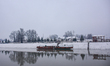 Snow is covering houseboats in the Jehlum River after heavy snowfall in Srinagar, Indian A...