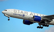 A Boeing 777-224(ER) in Star Alliance livery from United Airlines is taking off from Barce...