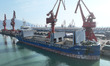 Cargo ships are unloading newly arrived chemical fertilizers at the port terminal in Liany...