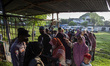 Residents are lining up to buy cheap rice from the government's Food Price Control Stabili...